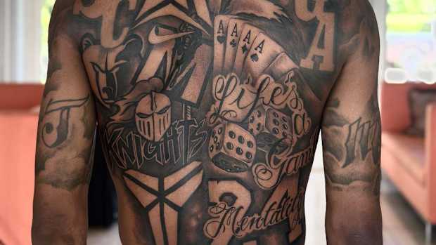 View of Ja Morant's back tattoos.